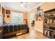 Comfortable bedroom with wood floors, ceiling fan, and adjacent office space at 3777 Peachtree Ne Rd # 412, Brookhaven, GA 30319