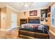 Rustic bedroom featuring wood-look tile floors and wood furniture, complemented by neutral wall colors and tasteful decor at 3777 Peachtree Ne Rd # 412, Brookhaven, GA 30319