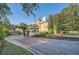 Community entrance with flags, fountains, and lush landscaping create a welcoming and prestigious atmosphere at 3777 Peachtree Ne Rd # 412, Brookhaven, GA 30319