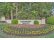 Well-manicured entrance featuring beautiful landscaping and decorative flowers at 3777 Peachtree Ne Rd # 412, Brookhaven, GA 30319