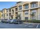 Well-maintained apartment building featuring reserved parking spaces, lush landscaping, and refined architectural details at 3777 Peachtree Ne Rd # 412, Brookhaven, GA 30319
