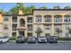 Elegant exterior of a multi-story apartment building with parking and manicured landscaping in a well-maintained community at 3777 Peachtree Ne Rd # 412, Brookhaven, GA 30319
