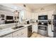Modern kitchen featuring white cabinets, stainless steel appliances, and granite countertops at 3777 Peachtree Ne Rd # 412, Brookhaven, GA 30319