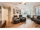 Inviting living room featuring wood floors, modern furnishings, and ample natural light at 3777 Peachtree Ne Rd # 412, Brookhaven, GA 30319