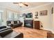 Living room with fireplace, tile flooring, modern furnishings, and a ceiling fan at 3777 Peachtree Ne Rd # 412, Brookhaven, GA 30319