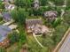 Stunning aerial view of a home surrounded by mature trees, highlighting the property's spacious lot at 4823 Layfield Dr, Atlanta, GA 30338