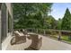 Spacious deck with outdoor seating offers a serene space to unwind and enjoy the lush backyard at 4823 Layfield Dr, Atlanta, GA 30338