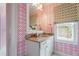 Bathroom featuring a patterned wall, granite countertop, and a bright window at 4823 Layfield Dr, Atlanta, GA 30338
