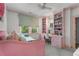 Comfortable bedroom with custom built-ins, shelving, and desk area at 4823 Layfield Dr, Atlanta, GA 30338