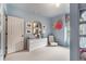Bedroom showcasing a white dresser, a chair, and decorative wall art at 4823 Layfield Dr, Atlanta, GA 30338