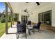Inviting covered porch with ceiling fan, and brick siding offers relaxing outdoor living at 4823 Layfield Dr, Atlanta, GA 30338