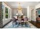 Elegant dining room with stylish decor, a large window, and a statement chandelier at 4823 Layfield Dr, Atlanta, GA 30338