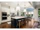 Well-equipped kitchen with a center island, stainless appliances, and easy access to the dining area at 4823 Layfield Dr, Atlanta, GA 30338