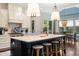 Well-appointed kitchen with a large center island, stainless steel appliances, and designer lighting at 4823 Layfield Dr, Atlanta, GA 30338