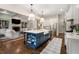 Spacious kitchen with a dark blue island, white cabinets, stainless steel appliances, and open to the living room at 4823 Layfield Dr, Atlanta, GA 30338
