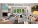Comfortable living room with a fireplace, built-in shelving, and a large sectional sofa at 4823 Layfield Dr, Atlanta, GA 30338