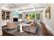 Inviting living room with coffered ceilings, a fireplace, and large windows overlooking greenery at 4823 Layfield Dr, Atlanta, GA 30338