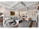 Cozy living room with coffered ceilings, a fireplace, and an open view to the foyer and dining room at 4823 Layfield Dr, Atlanta, GA 30338