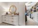 Walk-in closet area with built-in shelving and drawers, plus a view into the main closet at 4823 Layfield Dr, Atlanta, GA 30338