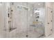 Modern shower features dual shower heads, corner seat, and elegant tile work at 4823 Layfield Dr, Dunwoody, GA 30338