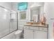 Bright bathroom featuring a glass-enclosed shower, granite countertop, and ample natural light at 4823 Layfield Dr, Dunwoody, GA 30338