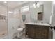 Modern bathroom with a glass-enclosed shower, and a dark wood vanity at 4823 Layfield Dr, Dunwoody, GA 30338