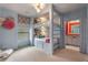Charming bedroom featuring custom-built bunk beds with storage, complemented by soft blue walls and playful decor at 4823 Layfield Dr, Dunwoody, GA 30338