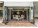 The bright dining area features hardwood floors and glass doors to seamlessly blend indoor and outdoor spaces at 4823 Layfield Dr, Dunwoody, GA 30338
