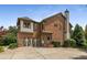 Beautiful brick home featuring a two-car garage and well-manicured landscaping at 4823 Layfield Dr, Dunwoody, GA 30338