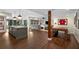Open-concept basement with kitchen, living area and dark hardwood floors at 4823 Layfield Dr, Dunwoody, GA 30338