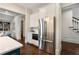 Stainless steel refrigerator and white cabinets provide ample storage in this well-appointed kitchen at 4823 Layfield Dr, Dunwoody, GA 30338
