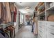 Spacious walk-in closet with custom shelving, drawers, and ample hanging space for clothes and accessories at 4823 Layfield Dr, Dunwoody, GA 30338
