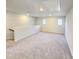 Spacious bonus room with neutral carpet, recessed lighting, and large windows at 670 Redhead Way (Lot 23), Grayson, GA 30017