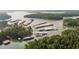 Aerial view of a picturesque waterfront community featuring private boat docks and lake access at 520 Pearl St, Cumming, GA 30040