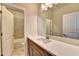 Modern bathroom featuring a large mirror, stylish fixtures, and tiled tub/shower combination at 520 Pearl St, Cumming, GA 30040