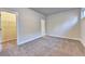 Bedroom with neutral carpeting, an en suite bath and walk-in closet at 520 Pearl St, Cumming, GA 30040