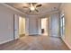 Bright, spacious bedroom with neutral carpet and double doors to ensuite bathroom at 520 Pearl St, Cumming, GA 30040