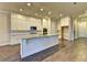 Stylish kitchen with white cabinets, a large island, and modern appliances for culinary enthusiasts at 520 Pearl St, Cumming, GA 30040