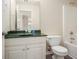 Bathroom with a green countertop, and a combination shower and tub at 602 Jules Crest Ct, Lawrenceville, GA 30045