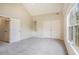 Spacious carpeted bedroom featuring closet space and natural lighting at 602 Jules Crest Ct, Lawrenceville, GA 30045