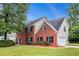 Beautiful two-story home featuring brick and siding with a well-manicured lawn at 602 Jules Crest Ct, Lawrenceville, GA 30045
