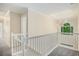 Second floor hallway with a skylight and a view of the backyard at 602 Jules Crest Ct, Lawrenceville, GA 30045
