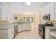 Bright kitchen features granite countertops, stainless steel appliances, and tile flooring at 602 Jules Crest Ct, Lawrenceville, GA 30045