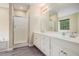 Main bathroom features double sink vanity, stand up shower and soaking tub at 602 Jules Crest Ct, Lawrenceville, GA 30045