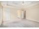 Main bedroom with carpet, double trey ceiling, and ensuite bathroom at 602 Jules Crest Ct, Lawrenceville, GA 30045