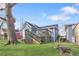 A backyard featuring a deck, green lawn, and mature trees offering a private outdoor space at 1087 Longley Nw Ave, Atlanta, GA 30318
