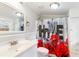 Bathroom features a vanity with mirror, a HOME-themed shower curtain, and bright lighting at 1087 Longley Nw Ave, Atlanta, GA 30318
