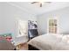 Bedroom featuring hardwood floors, two bright windows, and a ceiling fan at 1087 Longley Nw Ave, Atlanta, GA 30318
