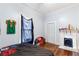 Bedroom featuring hardwood floors, neutral walls, a closet, and a decorative fireplace at 1087 Longley Nw Ave, Atlanta, GA 30318