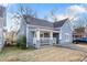 Charming blue home featuring a welcoming front porch and a well-maintained lawn at 1087 Longley Nw Ave, Atlanta, GA 30318